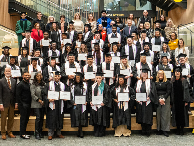 Group photo from Spero graduation with attendees on the social stairs..