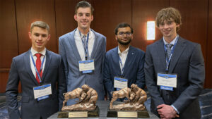 Wichita State University students pose with the awards CSMIF earned at The G.A.M.E. Forum.
