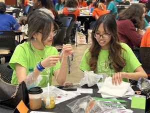 Two high school students at past IGED event