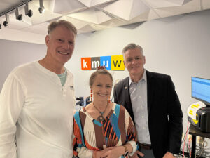 Rick Muma and Rick Case pose at the KMUW offices with Debra Fraser