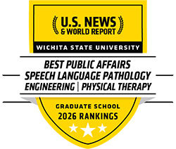 Yellow badge graphic with the text U.S. News & World Report with cartoon wheat stocks on both sides. Wichita State University on a black stripe. A white ribbon folds in front of the badge with the text Best Public Affairs, Speech Language Pathology, Engineering, Physical Therapy. The rest of the badge has the text Graduate School 2026 rankings and three stars, the middle one being larger than the others