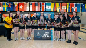 Members of the Shocker women's bowling team hold up their trophies from the Arlington Regional