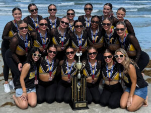 The Shocker dance team pose with the NDA trophy on the beach