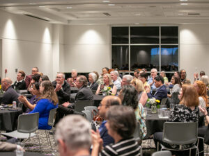 Faculty members clap at the Tenure and Promotion Awards celebration