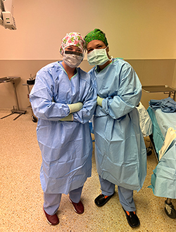 Madisyn Sampson in scrubs with other student next to her