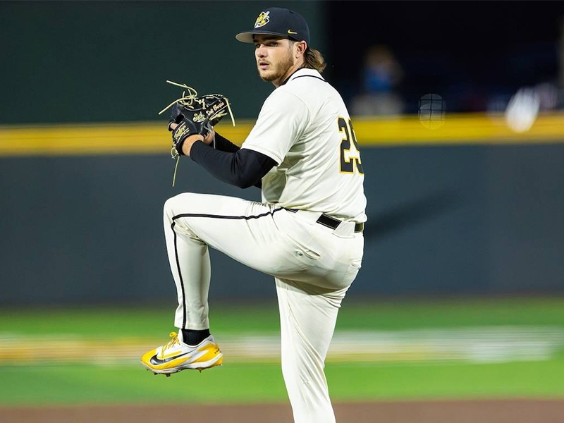 Karsen Richard winds up to pitch during a game at Charles Koch Arena