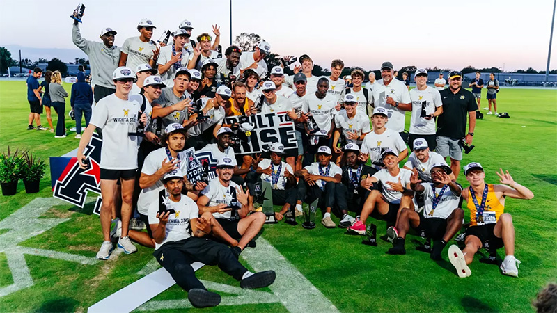 The men's track and field team poses with their trophies from the AAC championships