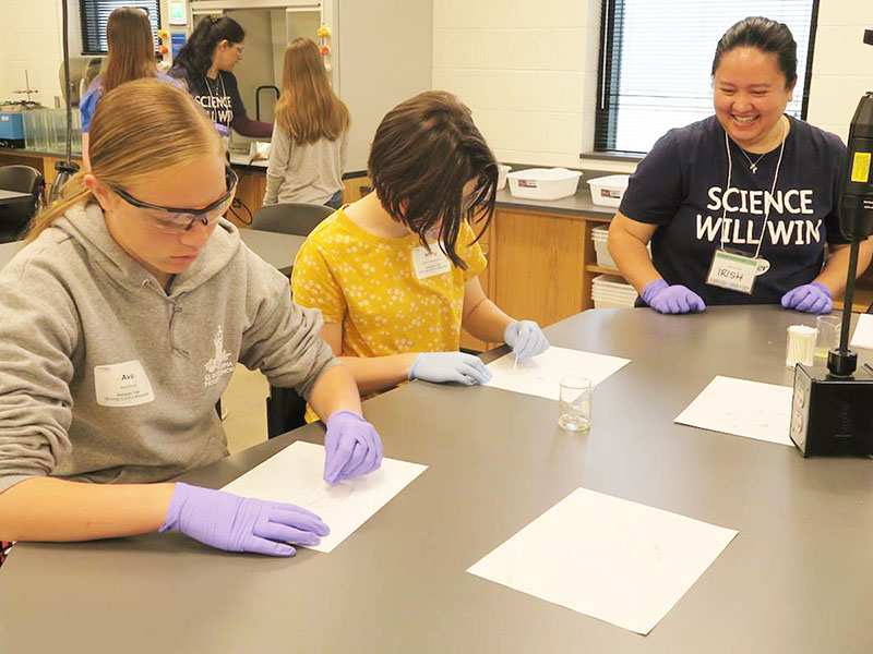 Students work on a science experiment during a class held at Wichita State