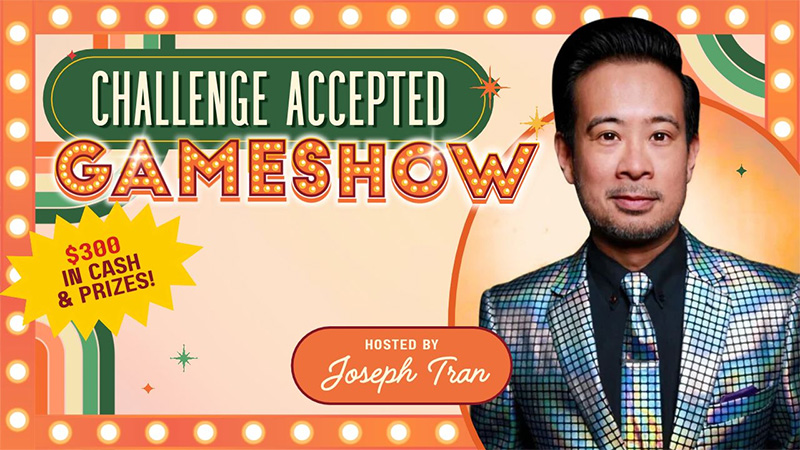 Gameshow Challenge Accepted hosted by artist Joseph Tran. Image contains image of an Asian male wearing a silver sparkly jacket against an orange background.