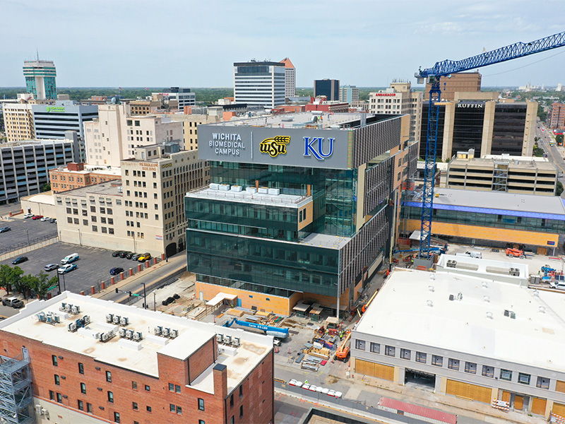 Drone photo of the Wichita Biomedical Campus, highlighting the new sign that reads "Wichita Biomedical Campus" beside the WSU and KU logos