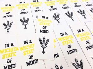 array of letterpress bookmarks that say "In a Wichita State of Mind" with a shock of wheat