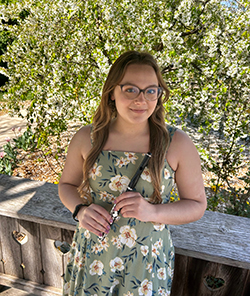 WSU student holding a flute.