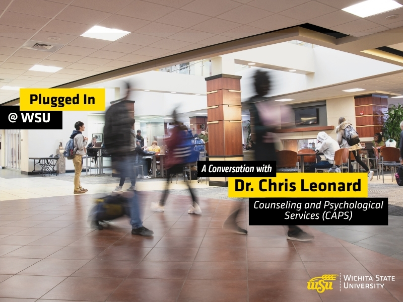 Students walk through a busy indoor campus commons area at Wichita State University. Several people are shown moving across the foreground with motion blur, while others sit and study at tables in the background. Overlay text reads "Plugged In @ WSU" and "A Conversation with Dr. Chris Leonard, Counseling and Psychological Services." The Wichita State University logo appears in the lower-right corner. The image promotes a podcast episode featuring WSU Success Coaches and highlights student activity and engagement on campus.