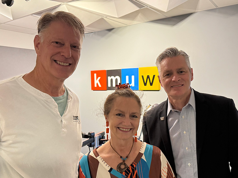 First Gentleman Rick Case, KMUW General Manager Debra Fraser, and Dr. Rick Muma